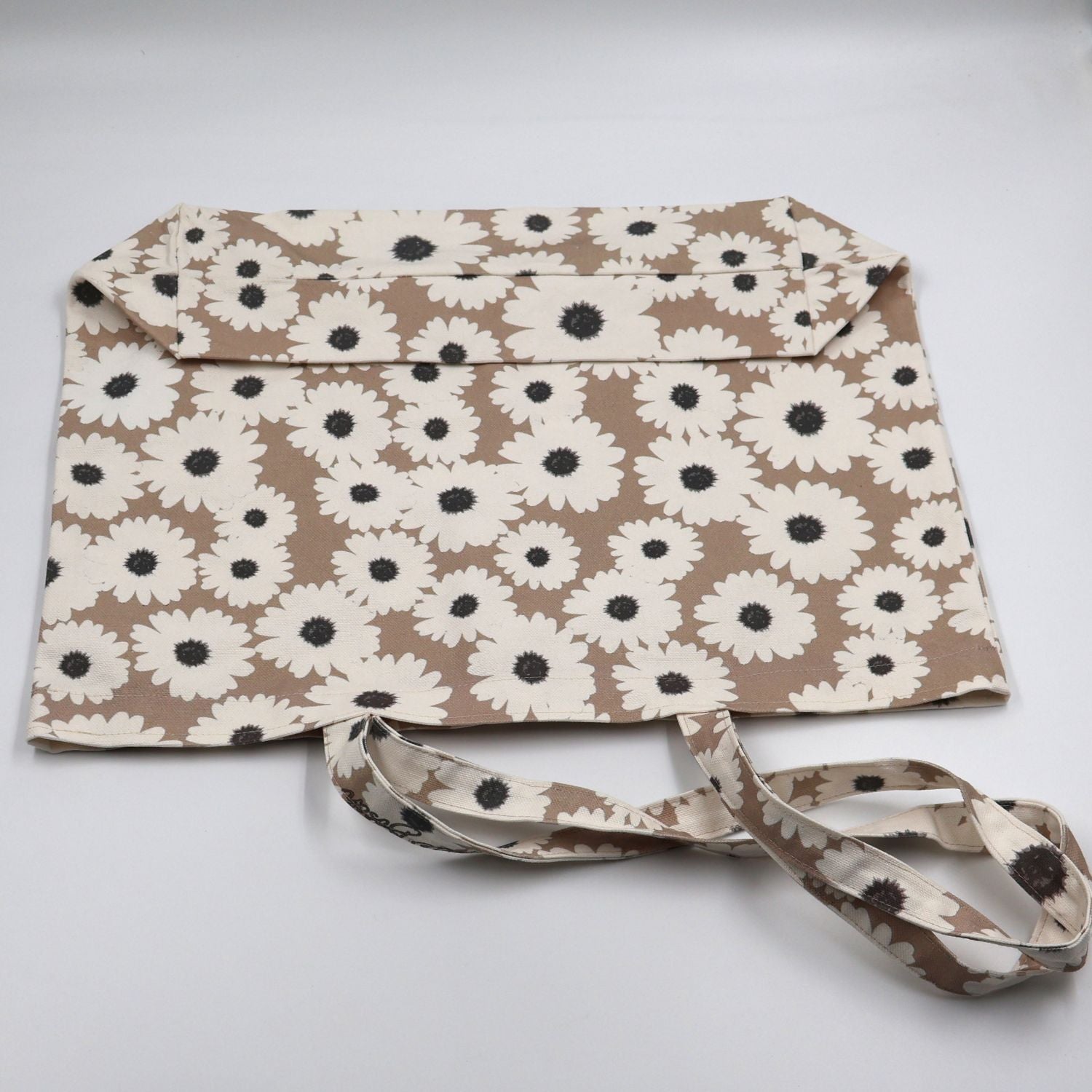 Close up view of quality stitching and finishes on Daisy Drift mushroom beige canvas tote bag