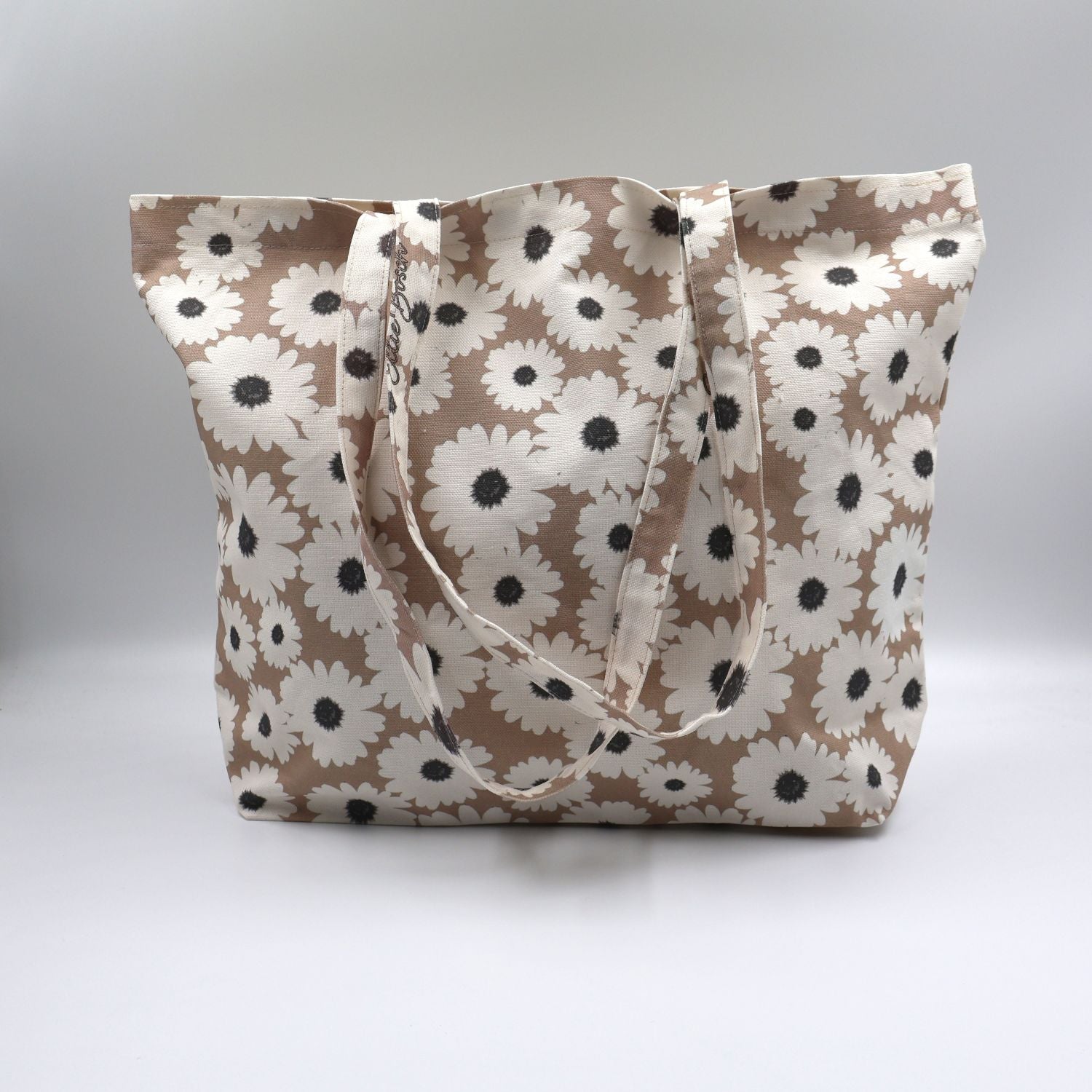 se up of Daisy Drift mushroom beige cotton canvas tote bag with white wildflowers made in South Africa