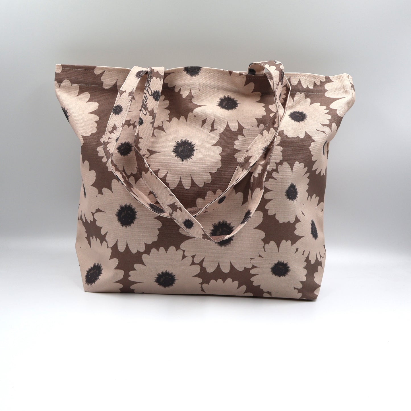 Front close up of Driftwood Brown cotton canvas tote bag with beige wildflowers made in South Africa