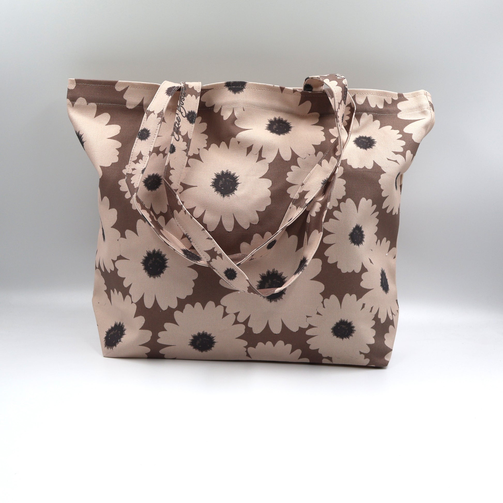 Front close up of Driftwood Brown cotton canvas tote bag with beige wildflowers made in South Africa
