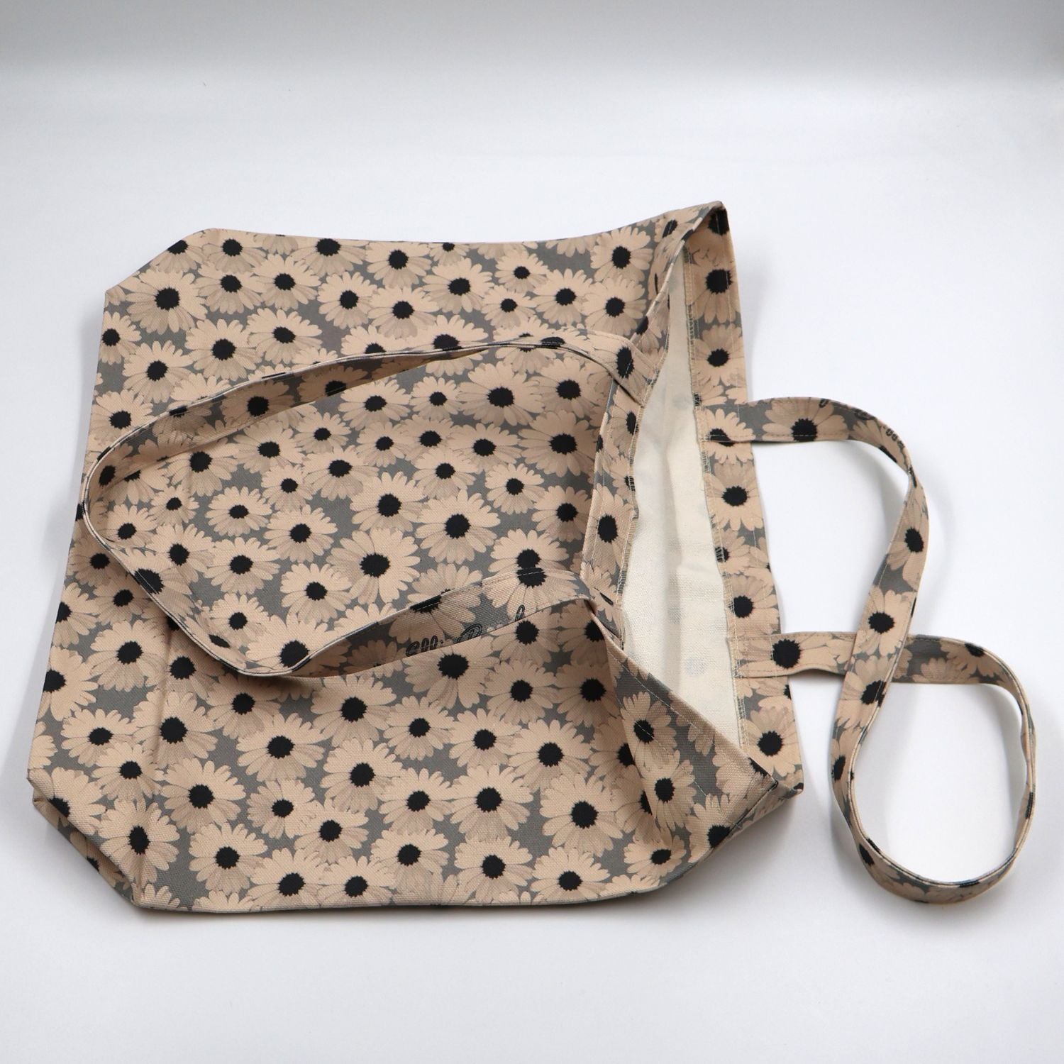 Flat lay view of the handmade ladies ocean slate grey canvas tote bag, showcasing the reinforced quality stitching, durable fabric finish, and flat-pack layout.