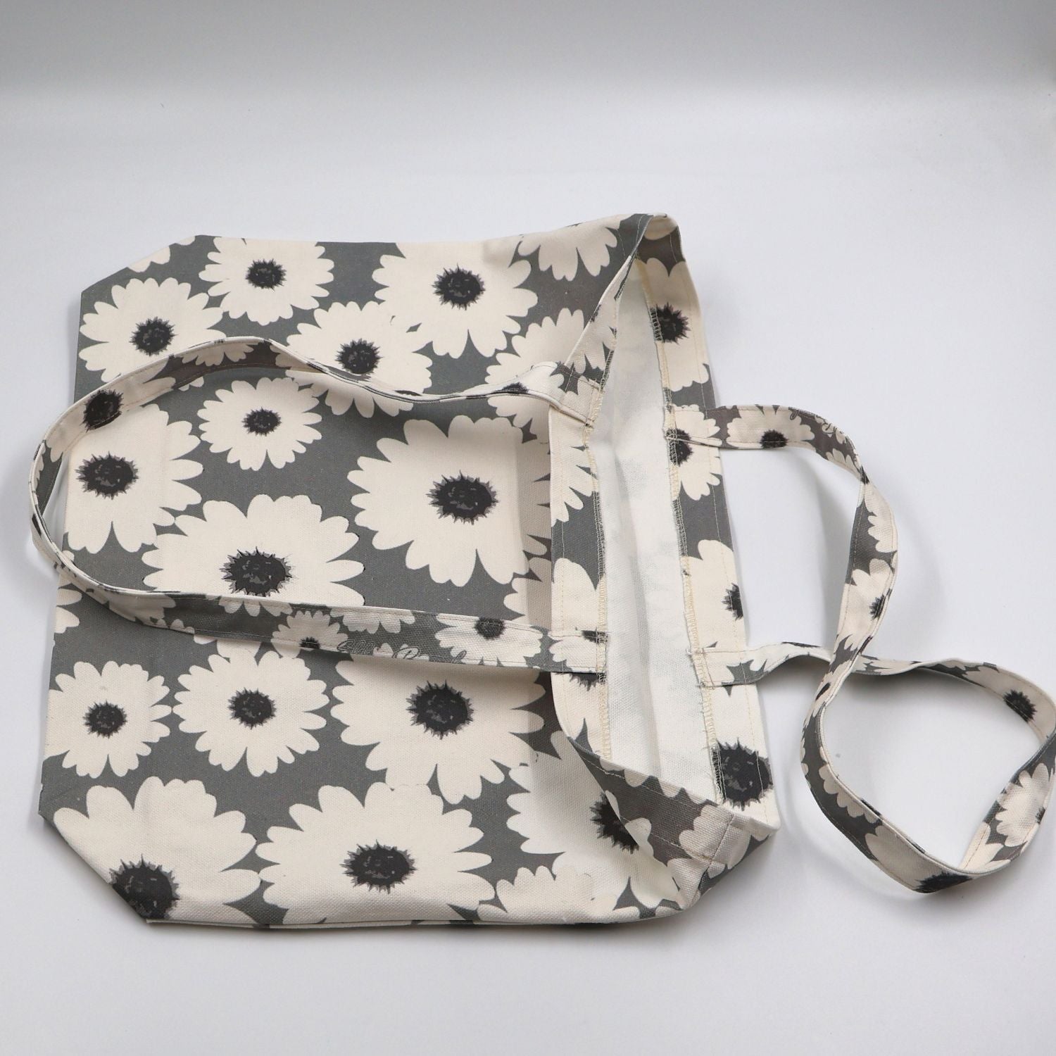 Flat lay view of the handmade ladies sea mist grey canvas tote bag, showcasing the reinforced quality stitching, durable fabric finish, and flat-pack layout.