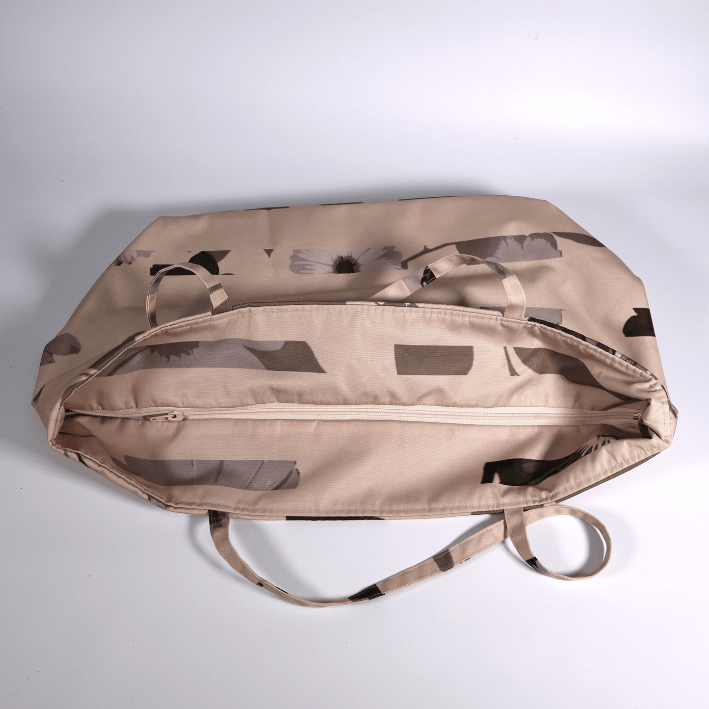 Secure top zip closure on a spacious canvas travel tote bag showing internal storage capacity for daily essentials.