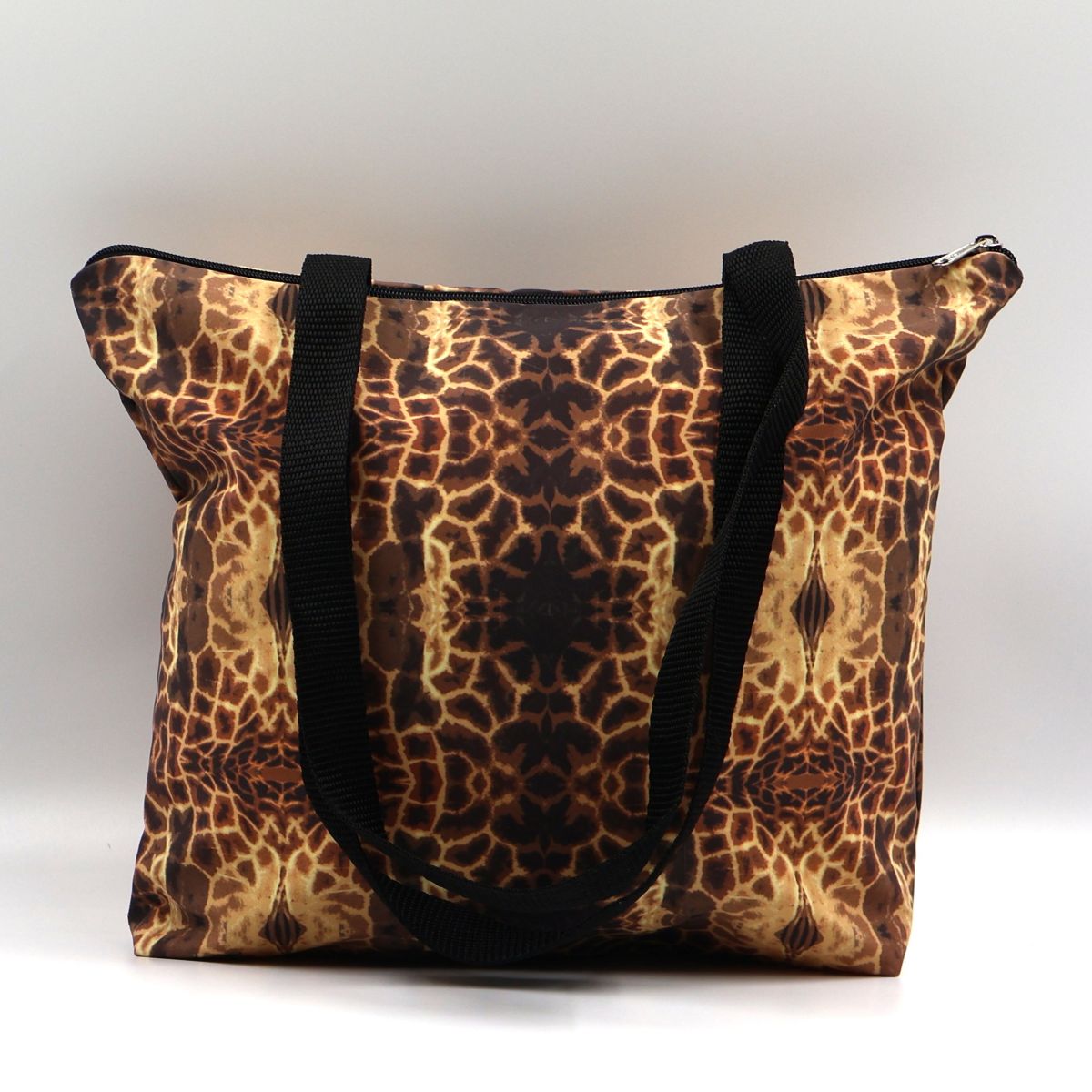 Front close up of Letheba brown waterproof zipped giraffe print canvas tote bag made in South Africa