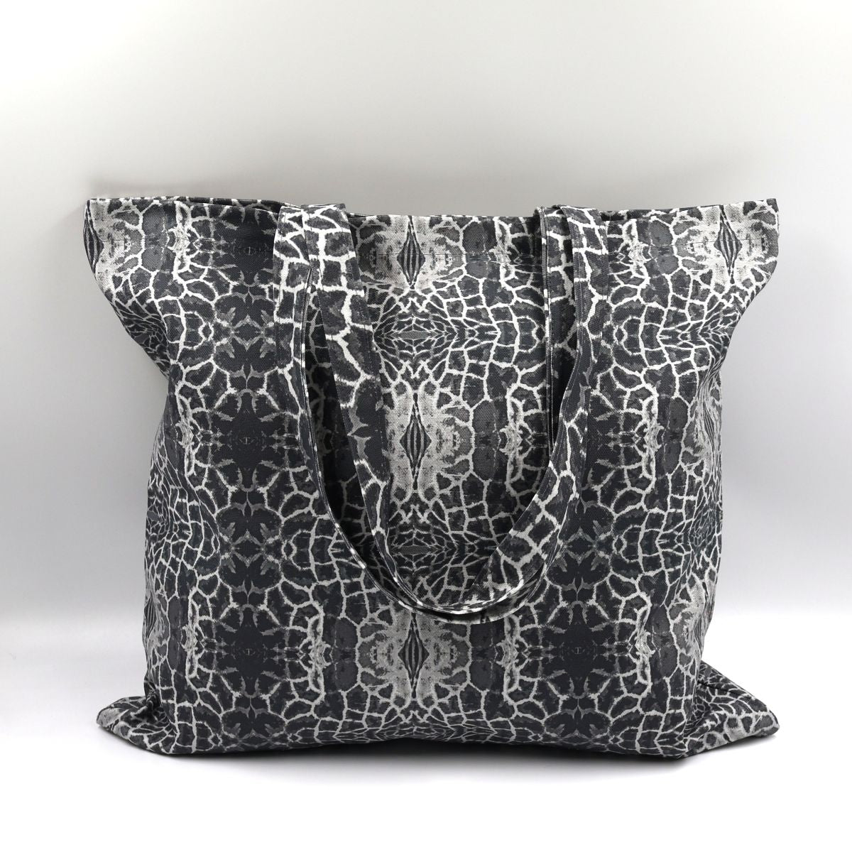 Front close up of Letheba charcoal giraffe print cotton canvas tote bag made in South Africa