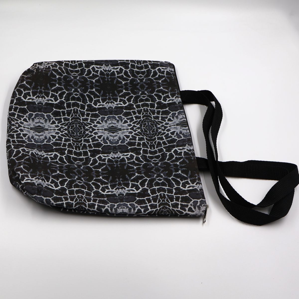 Close up view of the durable waterproof lining and premium stitching on charcoal giraffe canvas bag