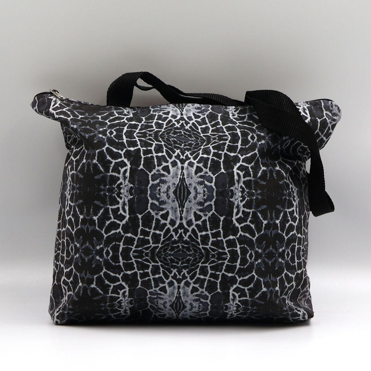 Front close up of Letheba charcoal waterproof zipped giraffe print canvas tote bag made in South Africa