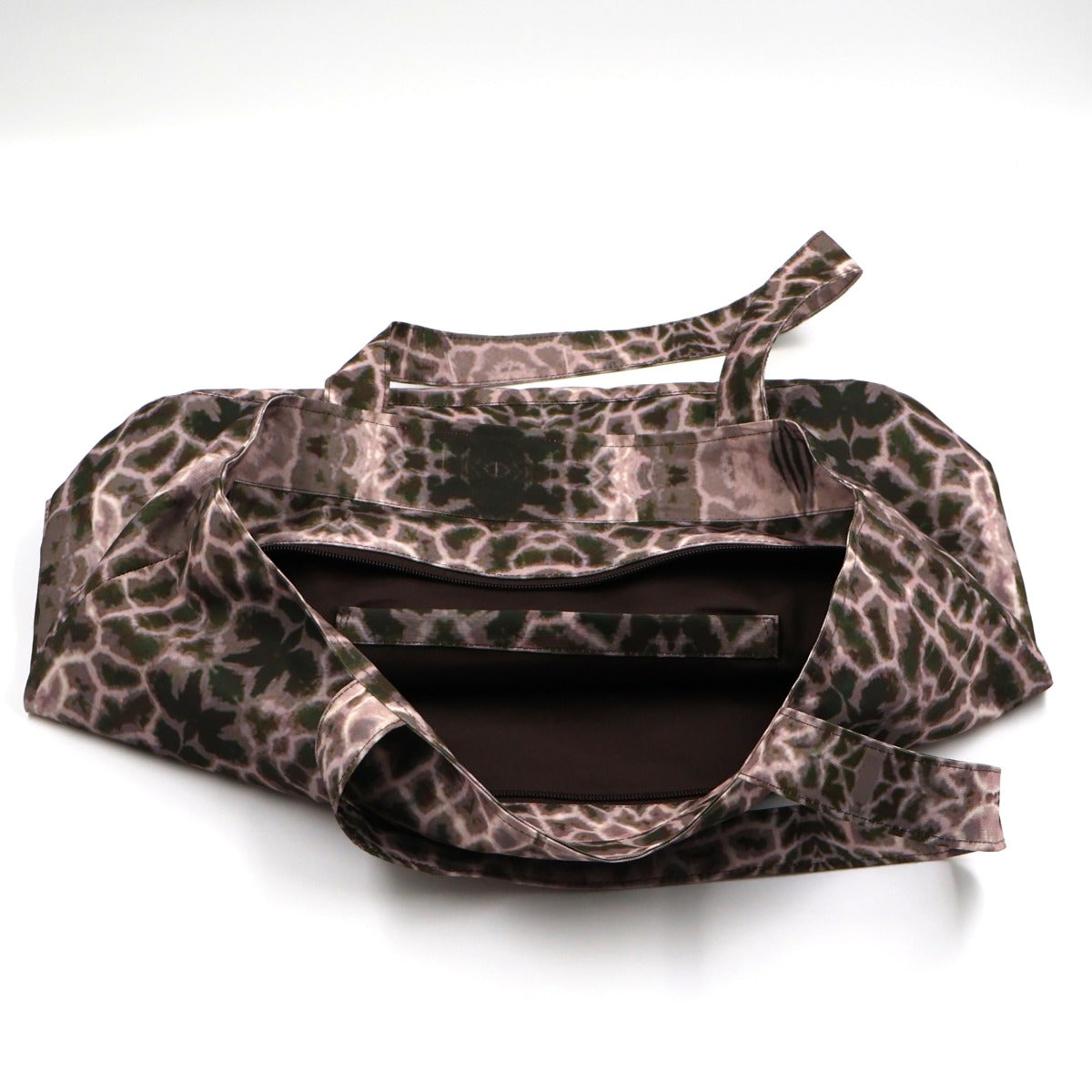 Close up view of dual carry handles and durable stitching on mauve and grey canvas tote bag