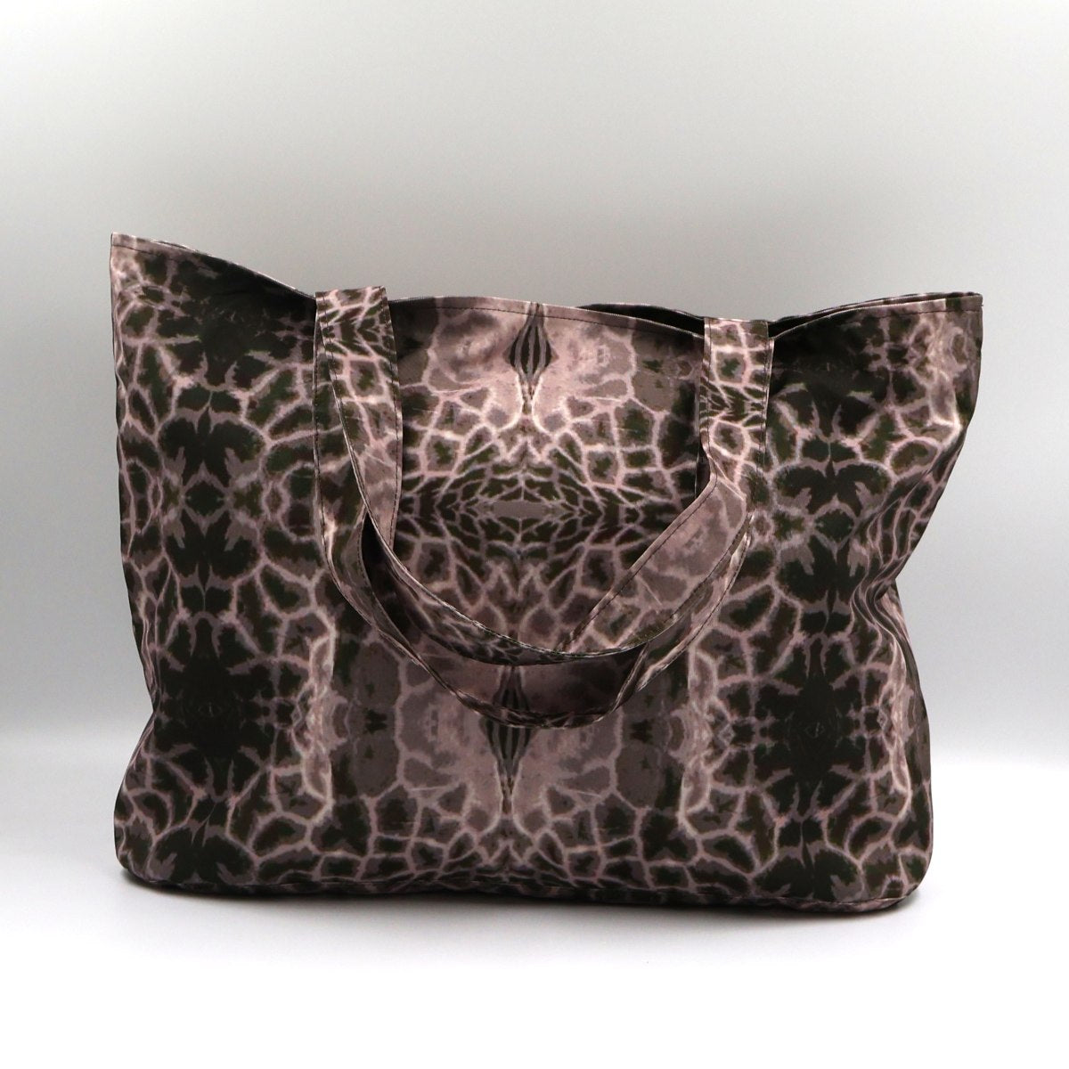Front close up of Letheba dusky mauve and grey zipped giraffe print polyester canvas tote bag made in South Africa