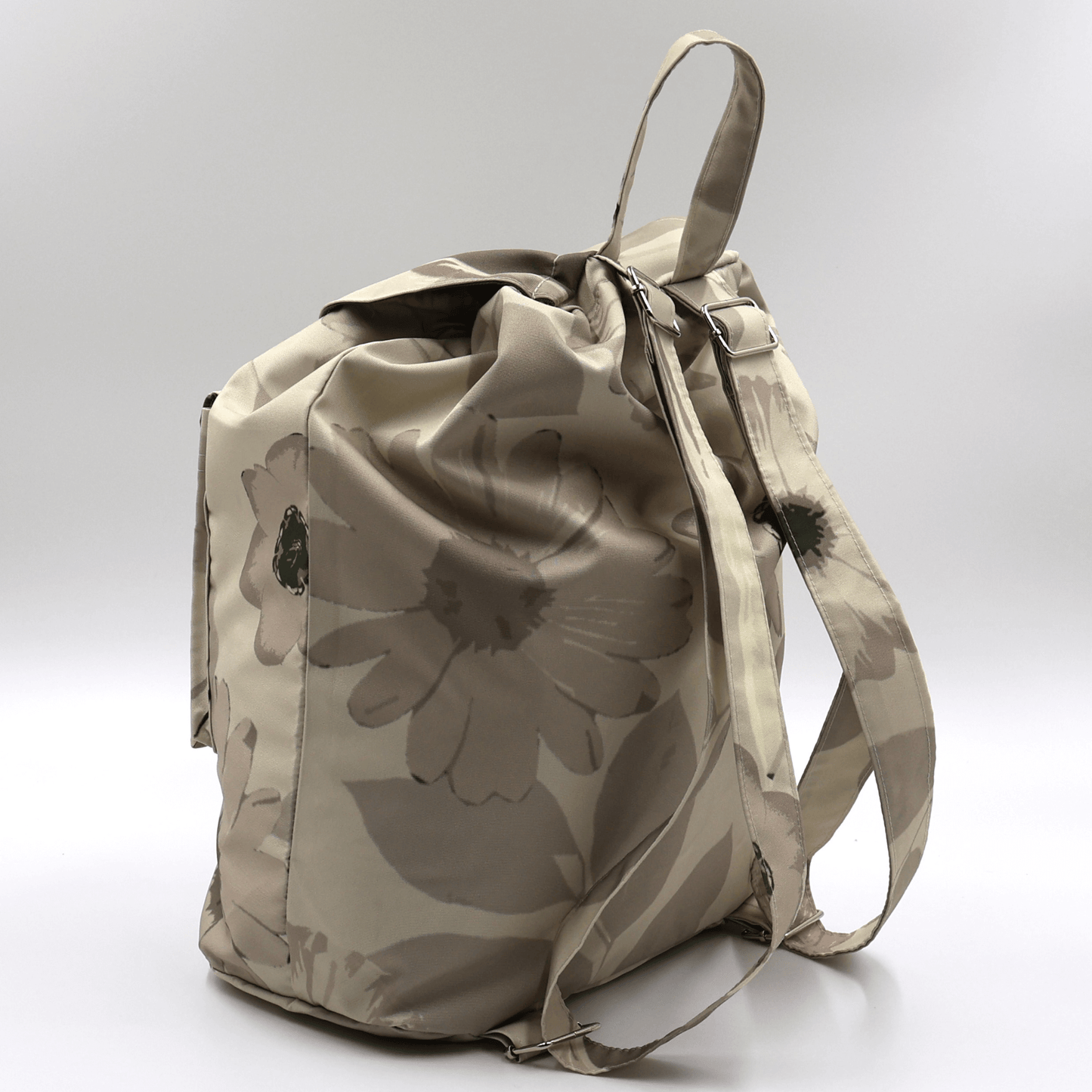The lightweight beige canvas travel backpack with adjustable straps from the South African Stone Meadow collection.