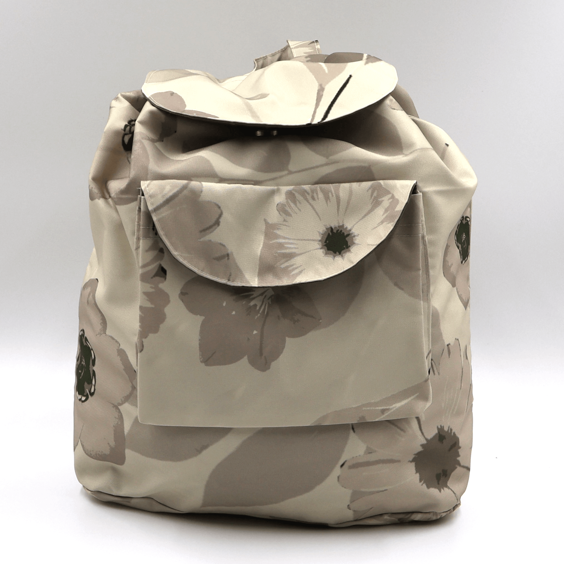 Lightweight foldable canvas backpack for travel in South Africa featuring the Ellie B Moonrise beige and cream scattered petals design.