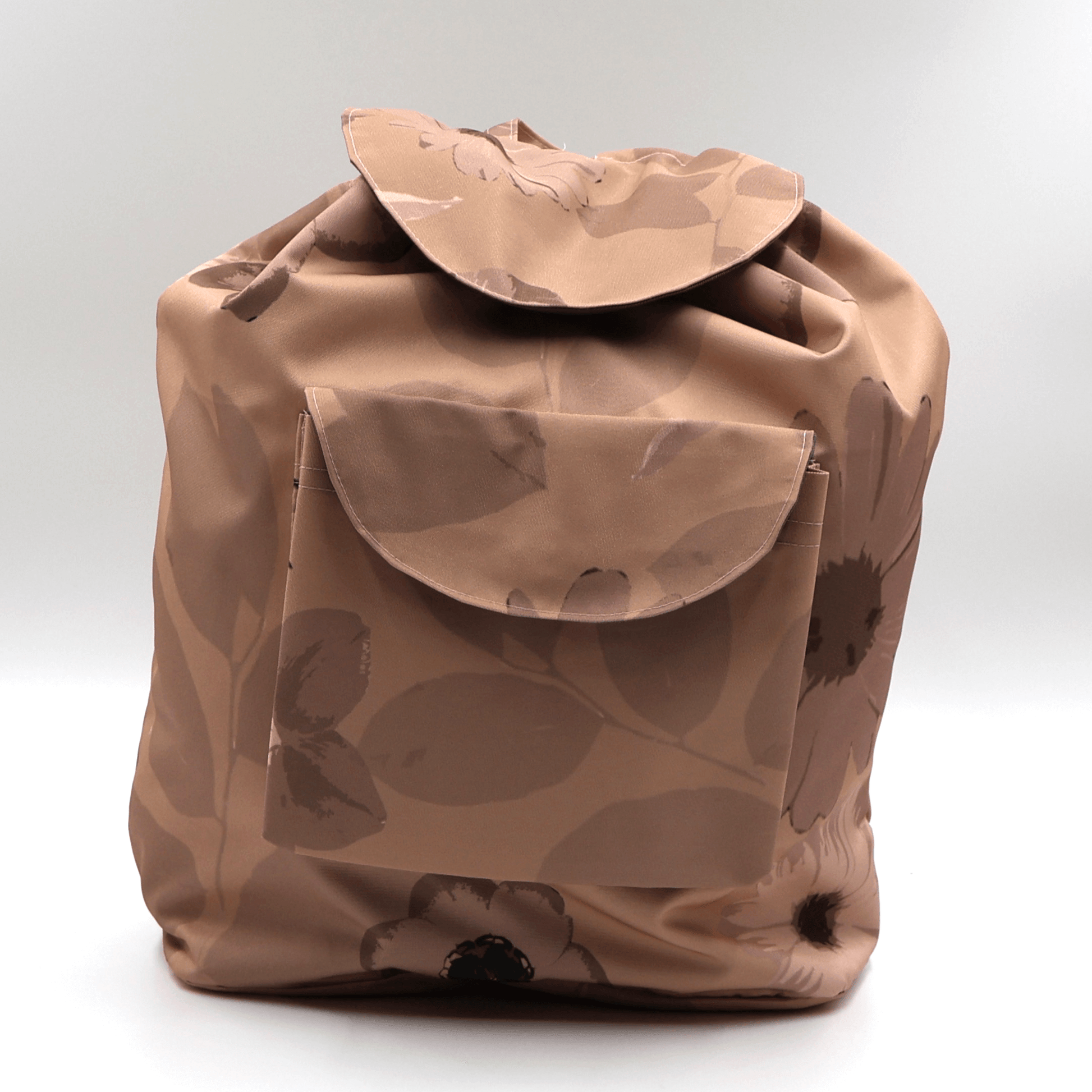 Lightweight foldable canvas backpack for travel in South Africa featuring the Ellie B Peach Moon rusty orange and brown wildflower design