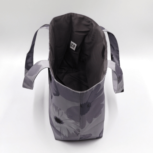 Internal storage view of a medium grey canvas book and craft bag showing the durable cotton twill lining and flat-bottom design.