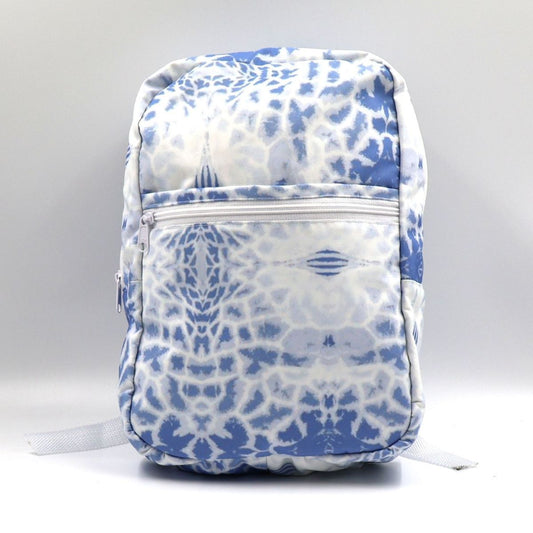 Front view of a small blue water-resistant polyester canvas backpack highlighting the giraffe print pattern and secure zippered front pocket.