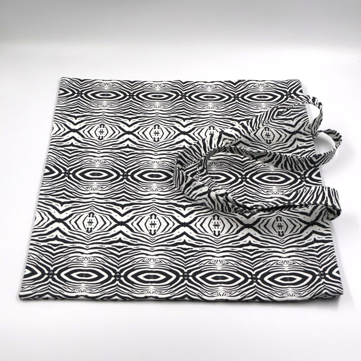 Flat lay view of Tshikwana Mohlala small stripe zebra print canvas tote bag showing graphic layout