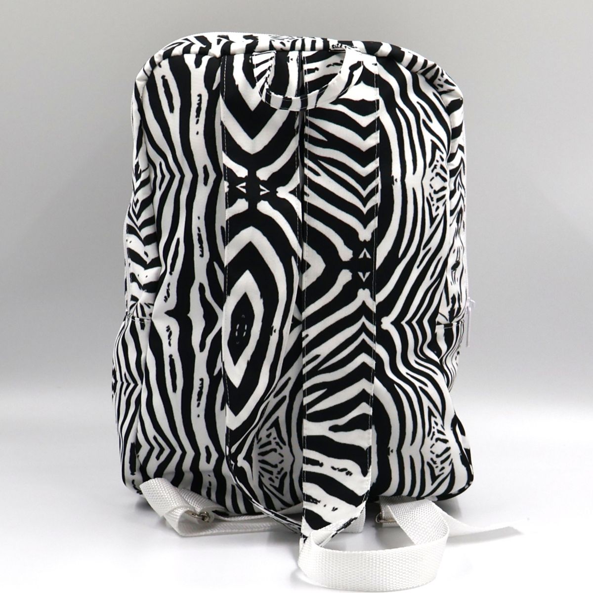 Back view of Tshikwana compact zebra print canvas backpack showing adjustable shoulder straps