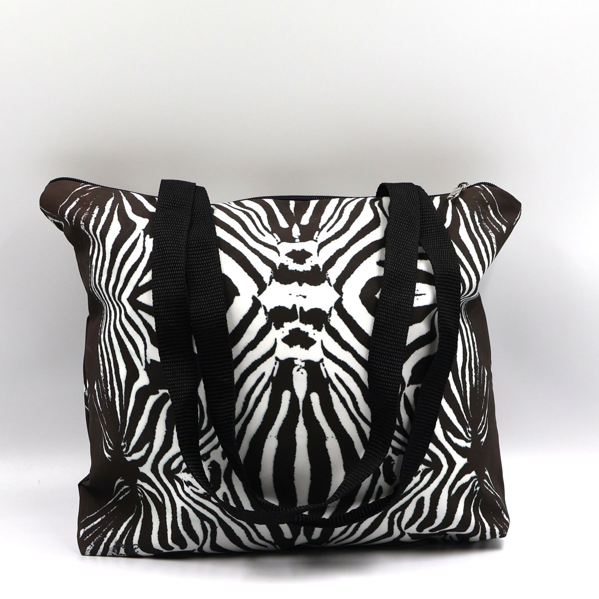 Front close up of Tshikwana waterproof zipped zebra print canvas tote bag made in South Africa